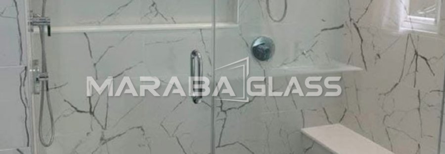 Modern frameless shower cubicle with 8mm tempered safety glass installed by Maraba Glass & Aluminum Systems Ltd.