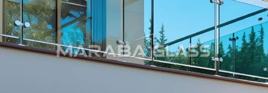 Frameless glass balustrade installation on a modern home balcony in Kenya.